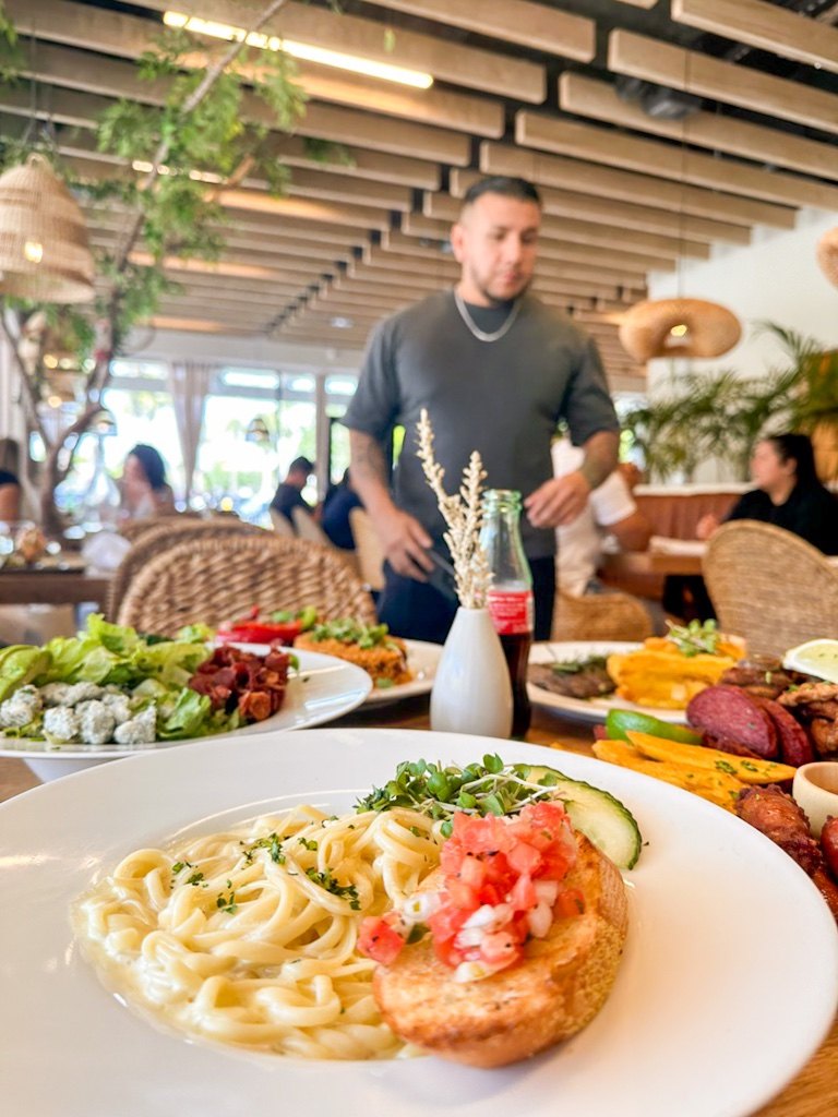 A table set with dishes from the kitchen.